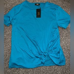New in packaging. Lucky & Blessed Brand Women’s turquoise top. Sizes XL-3X